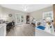 Room featuring french doors, a ceiling fan, and laminate floors at 1410 Daley Ridge Ct, Lawrenceville, GA 30045