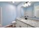 Bathroom with a white vanity, granite counters, modern fixtures, and a frameless mirror at 2538 Three Bars Drive, Grayson, GA 30017