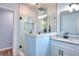 Modern bathroom featuring glass shower, white tile, granite countertop, and black fixtures at 2538 Three Bars Drive, Grayson, GA 30017