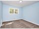 This bedroom offers neutral carpet, blue walls and a window providing natural light at 2538 Three Bars Drive, Grayson, GA 30017