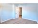 Light blue bedroom with carpet, an open door and a closet at 2538 Three Bars Drive, Grayson, GA 30017