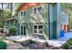 Charming home exterior showcasing a brick foundation, two-tone siding, and an inviting patio space at 2538 Three Bars Drive, Grayson, GA 30017
