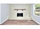 Neutral painted brick fireplace in a room with vinyl wood flooring at 2538 Three Bars Drive, Grayson, GA 30017