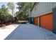 Exterior showcasing a two-car garage, concrete driveway and landscaping at 2538 Three Bars Drive, Grayson, GA 30017