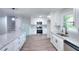 Renovated kitchen with stainless appliances and adjacent stairs at 2538 Three Bars Drive, Grayson, GA 30017