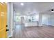 Open-concept living area with modern kitchen and sleek wood floors at 2538 Three Bars Drive, Grayson, GA 30017