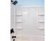 This shower offers a shower head, black hardware and built in shelves at 2538 Three Bars Drive, Grayson, GA 30017