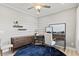Bright home office with floating shelves, modern decor, and a comfortable workspace at 328 Foxglove Way, Mcdonough, GA 30253