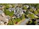 An aerial view of a traditional home with a pool, mature trees, and lush greenery at 5473 Heyward Square Pl, Marietta, GA 30068