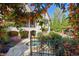 Beautiful backyard oasis with pool, lush landscaping, and flowering vines covering the stone and brick home at 5473 Heyward Square Pl, Marietta, GA 30068
