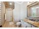 This bathroom features a granite countertop vanity and a shower with a white shower curtain at 5473 Heyward Square Pl, Marietta, GA 30068