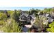 Inviting traditional home with a lush green landscape, a circular driveway, and a three-car garage at 5473 Heyward Square Pl, Marietta, GA 30068