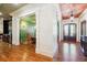 Elegant foyer with dark wood floors, coffered ceilings, and ornate architectural details at 5473 Heyward Square Pl, Marietta, GA 30068