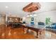 This unique game room layout features a bar area with seating along with a ping pong table and a pool table at 5473 Heyward Square Pl, Marietta, GA 30068