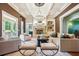 Inviting living room with coffered ceilings, a fireplace, hardwood floors, and french doors at 5473 Heyward Square Pl, Marietta, GA 30068