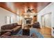 This bright living room features a stone fireplace, wood floors, and comfortable seating on the sofas and chairs at 5473 Heyward Square Pl, Marietta, GA 30068