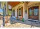 Charming front porch with stone pillars and a beautiful stone floor at 5473 Heyward Square Pl, Marietta, GA 30068