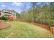 Spacious backyard with a playset and a tall wooden fence at 603 Redcoat Cir, Canton, GA 30114