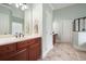 Bathroom features an extended vanity with dual sinks, tile floor, and modern lighting at 603 Redcoat Cir, Canton, GA 30114
