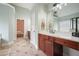 Spacious bathroom with dual sink vanities, tile floors, and modern lighting at 603 Redcoat Cir, Canton, GA 30114
