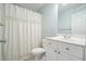 Bathroom featuring a toilet, white vanity, and a shower with a patterned curtain at 603 Redcoat Cir, Canton, GA 30114