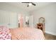 Bedroom with a ceiling fan, wooden floor, and light pink accents at 603 Redcoat Cir, Canton, GA 30114