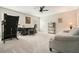 Spacious bonus room features plush carpet, ceiling fan, and ample space for activities and relaxation at 603 Redcoat Cir, Canton, GA 30114