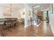 Spacious dining room featuring hardwood floors, wainscoting, and modern chandelier at 603 Redcoat Cir, Canton, GA 30114