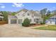 View of the house, showing attached garage and landscaping at 603 Redcoat Cir, Canton, GA 30114