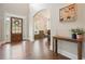 Grand foyer featuring hardwood floors, natural light, and console table at 603 Redcoat Cir, Canton, GA 30114