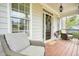 Inviting front porch with comfortable seating and a decorative front door, perfect for relaxing outdoors at 603 Redcoat Cir, Canton, GA 30114