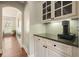Hallway with storage, granite countertop, and dark hardwood flooring at 603 Redcoat Cir, Canton, GA 30114
