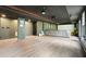 Spacious home theater with projector, fan, movie screen, recessed lights and hardwood floors at 603 Redcoat Cir, Canton, GA 30114