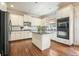 Well-lit kitchen features stainless steel appliances, granite countertops, and a central island at 603 Redcoat Cir, Canton, GA 30114
