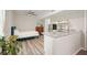 Efficient kitchenette combo with a bed, stainless steel refrigerator and granite countertops at 603 Redcoat Cir, Canton, GA 30114