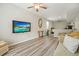 Cozy living room featuring a large flatscreen TV, ceiling fan, and comfortable seating at 603 Redcoat Cir, Canton, GA 30114