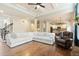 Bright, open-concept living space with coffered ceiling, fireplace, and hardwood floors at 603 Redcoat Cir, Canton, GA 30114