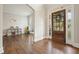 Spacious living room featuring hardwood floors and playroom with a large front window offering natural light at 603 Redcoat Cir, Canton, GA 30114