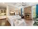 Open-concept living room featuring a stone fireplace and coffered ceilings at 603 Redcoat Cir, Canton, GA 30114