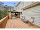 Outdoor patio with seating, fireplace, grill, and a view of the spacious yard at 603 Redcoat Cir, Canton, GA 30114