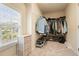 Walk-in closet features wire shelving for clothing and shoe storage with natural light at 603 Redcoat Cir, Canton, GA 30114