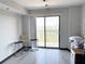 Bright bedroom with sliding glass doors opening to a balcony and views at 795 Hammond Dr # 806, Sandy Springs, GA 30328