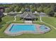 Aerial view of a community pool and clubhouse on a sunny day at 866 Coopers Ridge Sw Path, Grayson, GA 30017