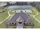 Aerial view of community clubhouse with pool and tennis courts at 866 Coopers Ridge Sw Path, Grayson, GA 30017