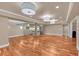 Open finished basement featuring wood floors, recessed lighting, and a kitchen area at 866 Coopers Ridge Sw Path, Grayson, GA 30017