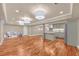 Open finished basement with wood floors, recessed lighting, kitchen area, and entertainment space at 866 Coopers Ridge Sw Path, Grayson, GA 30017