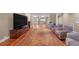 Open basement layout featuring hardwood floors, media center and seating at 866 Coopers Ridge Sw Path, Grayson, GA 30017