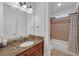 Bathroom with granite countertops, tile shower and tub, neutral paint, and upgraded finishes at 866 Coopers Ridge Sw Path, Grayson, GA 30017