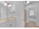 Bathroom with a single sink vanity, a framed mirror, and a separate shower and bathing area at 866 Coopers Ridge Sw Path, Grayson, GA 30017
