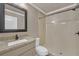 Clean bathroom featuring a granite vanity, a toilet, and a standing shower at 866 Coopers Ridge Sw Path, Grayson, GA 30017